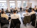 Veranstaltungsbericht Teilnehmende eines Workships sitzen in einem Stuhlkreis.